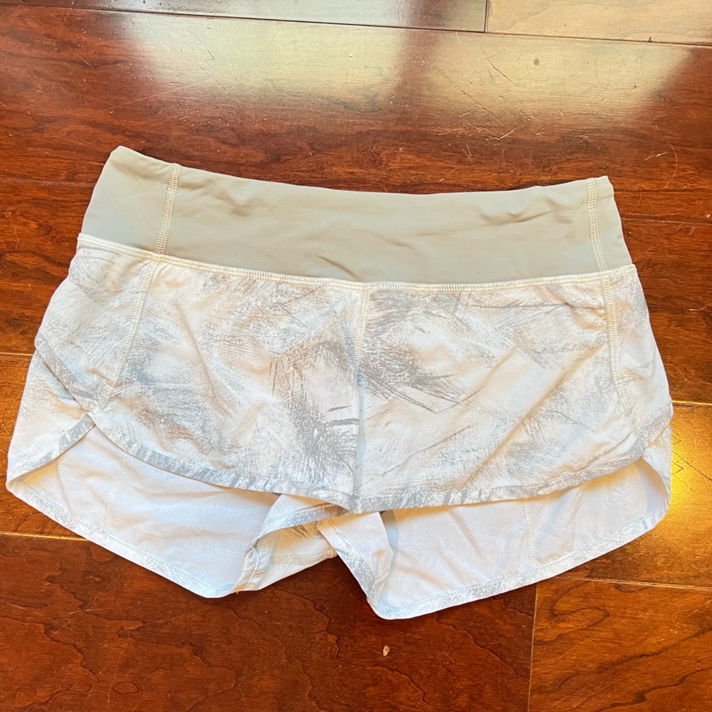 Lululemon speed shorts size 4. Gray waistband. Gray and white short.